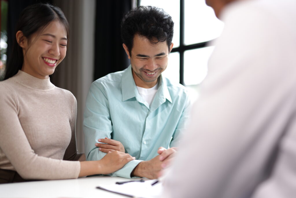 young couple talking to doctor